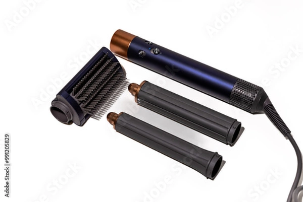 Fototapeta Professional hair styler, including a brush and hair dryer for drying hair, smoothing, and creating curls and waves - isolated on a white background.