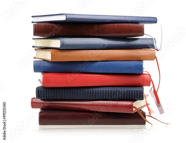 Obraz Stack of diaries or books with colorful covers on white background