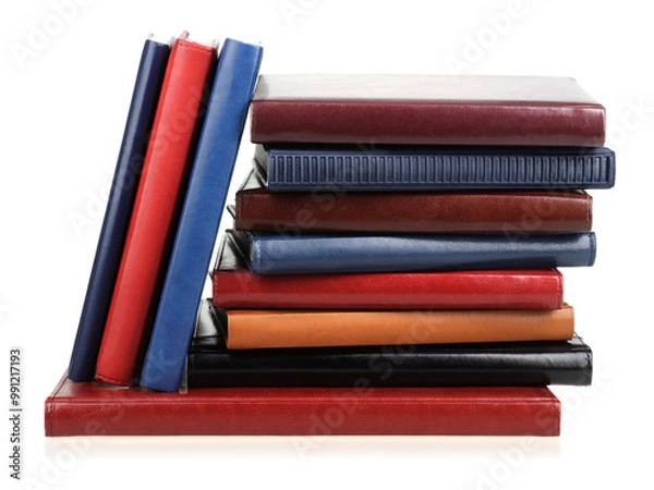 Obraz Stack of diaries or books with colorful covers on white background