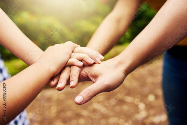Fototapeta Outdoor, parent and child with hands for stack, celebration and support on vacation by closeup. People, mother and kid with huddle gesture for connection, achievement and bonding together in nature