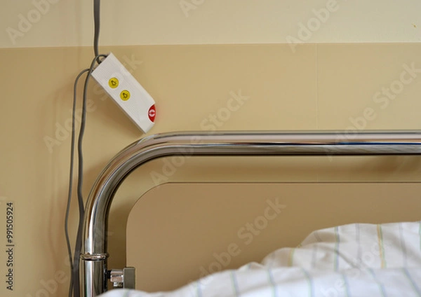 Obraz Detail of a hospital bed with emergency call button next to it