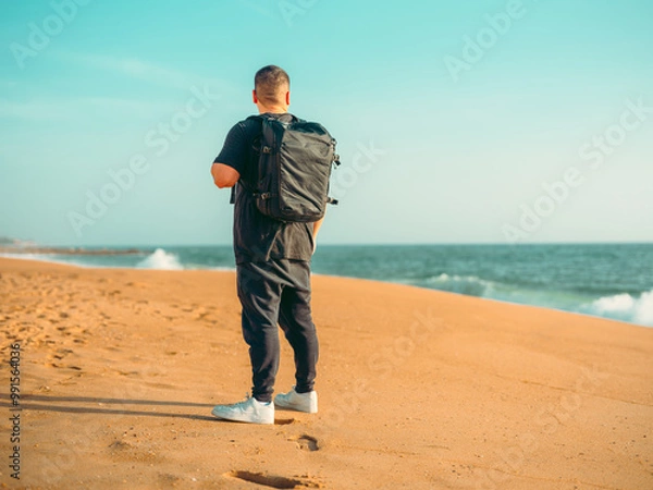 Obraz man walking on the beach