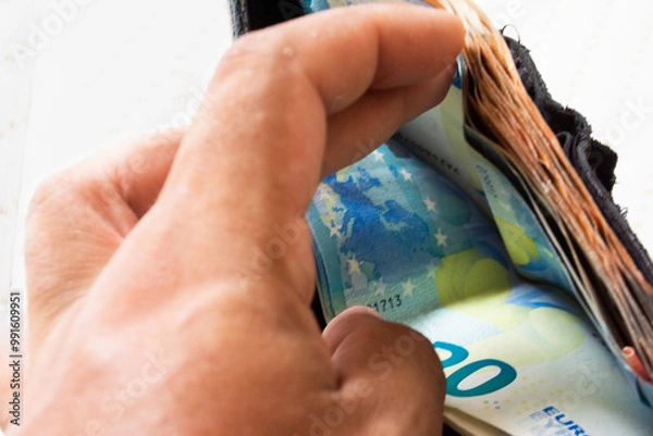 Fototapeta banknotes inside the leather wallet of 20 euros