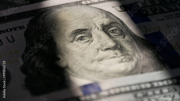 Fototapeta Close-up of a 100 dollar bill. The face of Benjamin Franklin. Macro