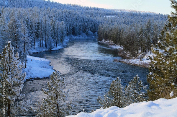 Fototapeta Spokane River Flowing Through a Snowy Forest