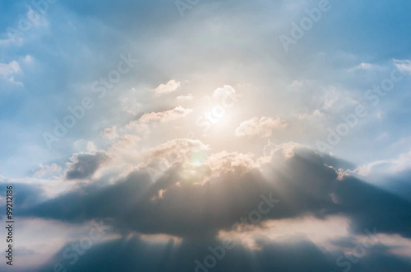 Obraz Rays of light shining through clouds, sunset