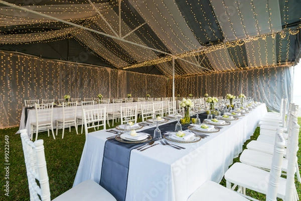 Obraz Elegance table set up with lotus flowers, selective focus.