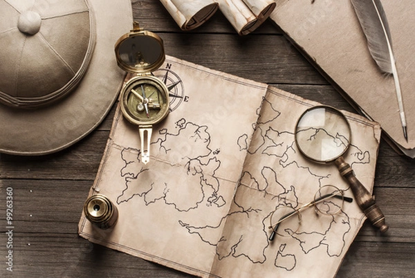 Fototapeta An old brass compass on map background