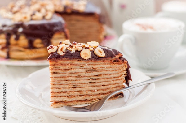 Fototapeta A Slice of Chocolate, Hazelnut and Cottage Cheese Crepe Cake
