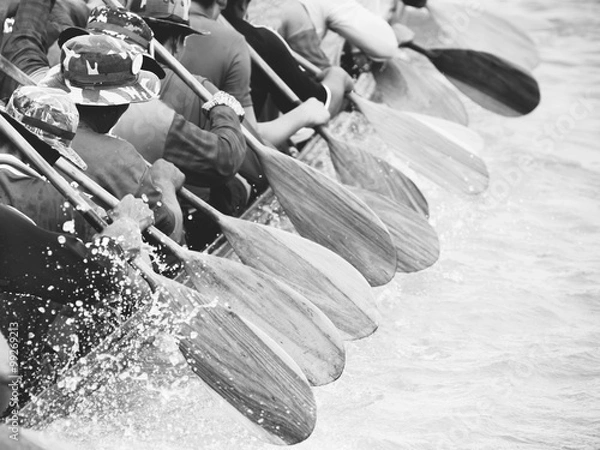 Fototapeta Close up of rowing team race with black and white effect