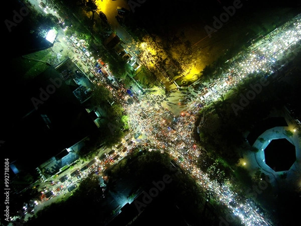 Fototapeta Night aerial view of a city highway with dense traffic