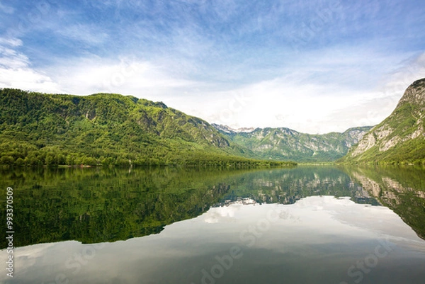 Fototapeta Clear mirror like lake Bohinj with mountains in background, Slovenia