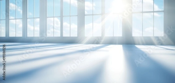 Fototapeta 3D Bright sunlight streams through large windows, illuminating a spacious room with a serene atmosphere and soft shadows.