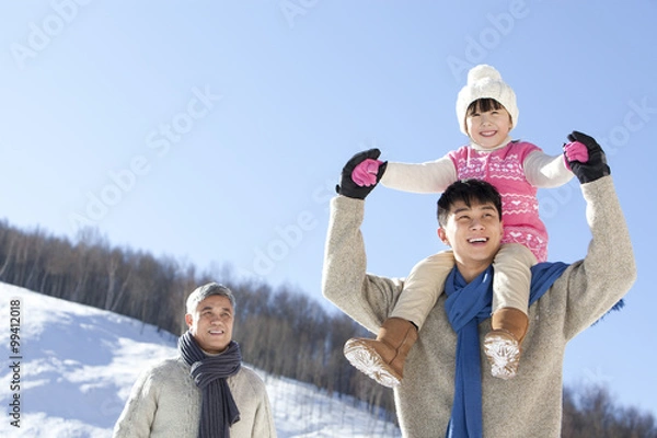 Obraz Three generation family having fun in snow