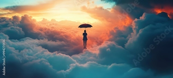 Fototapeta A person holding an umbrella, representing the idea of rising above the ordinary