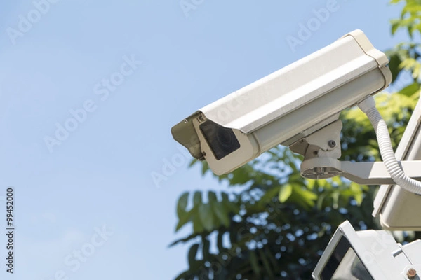 Fototapeta Security camera detects the movement on sky background watch rig