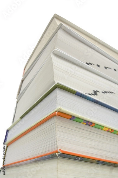 Fototapeta Bottom view of stacked books isolated against white background..
