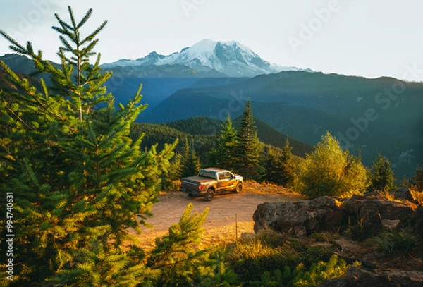Fototapeta A shot of a pick up truck in front of Mount Rainier during the sunset. A perfect spot for camping off the grid. Sun Top Mountain in Washington State, USA.