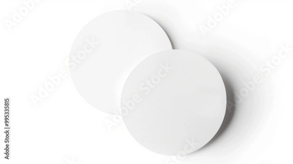 Fototapeta Two blank white round paper coasters on a white background. Mockup and product display concept.