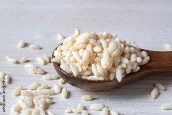 Obraz Closeup of Puffed Rice or Popped Rice on a Wooden Spoon Isolated on White Background with Copy Space, Also Known as Murmura or Muri, Indian Snack Food
