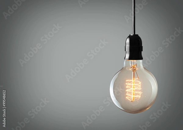 Obraz Vintage wisząca żarówka na szarym tle