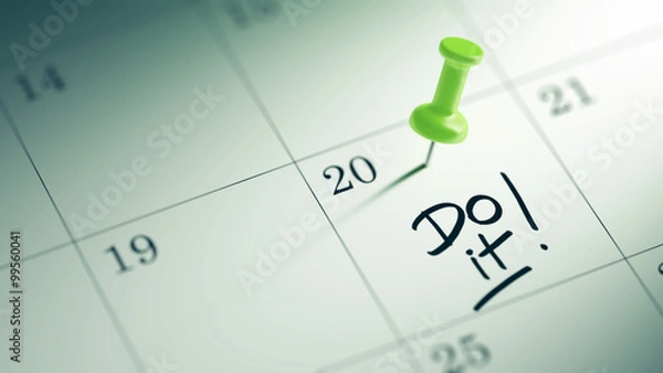 Fototapeta Concept image of a Calendar with a green push pin. Closeup shot