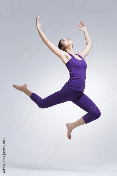 Fototapeta Young woman dancing