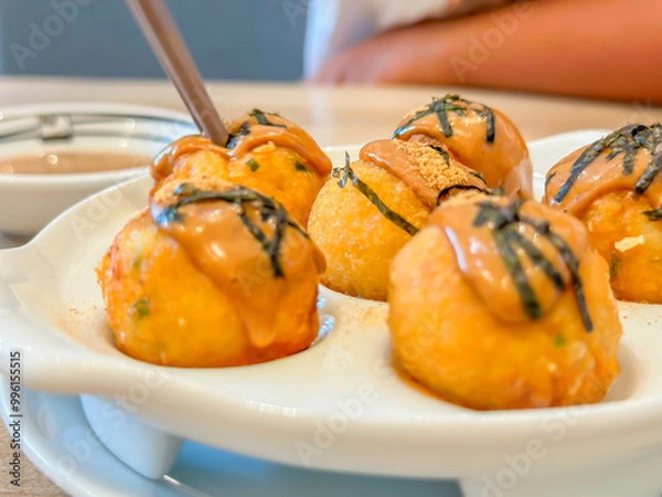 Obraz Closeup of takoyaki japanese confectionery in a white plate