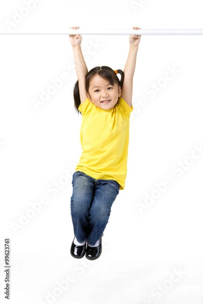 Obraz Little girl hangs from bar