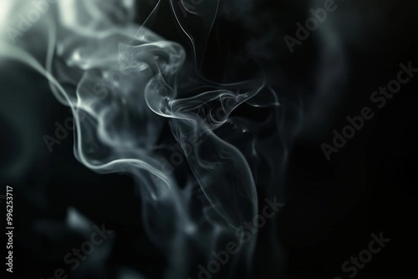 Fototapeta A black and white photo of smoke with a dark background