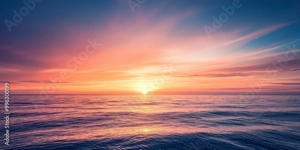 Fototapeta A breathtaking sunset with vibrant colors painted across the sky reflecting on the serene and expansive ocean waters.