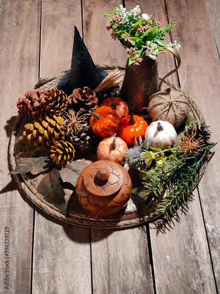 Fototapeta Halloween objects on a tray with a wooden background.