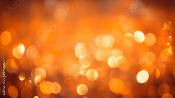 Fototapeta Blur bookeh colorful lights or flashes on a vivid orange color background