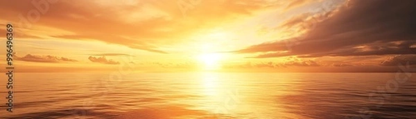 Fototapeta Stunning ocean sunset with vibrant golden hues and dramatic clouds, creating a serene and breathtaking view over calm waters.