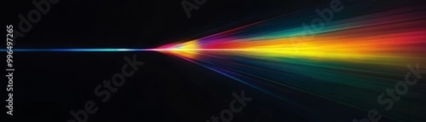 Fototapeta Dynamic light beam displaying a vibrant spectrum of colors on a dark background, representing energy and illumination