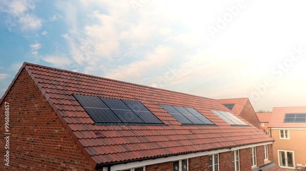 Fototapeta The roof of a new build house with integrated solar panels