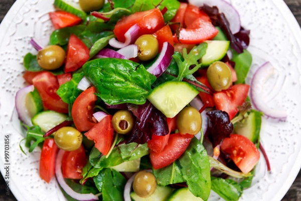 Fototapeta Fresh raw Vegetable mixed salad. close up view from top.