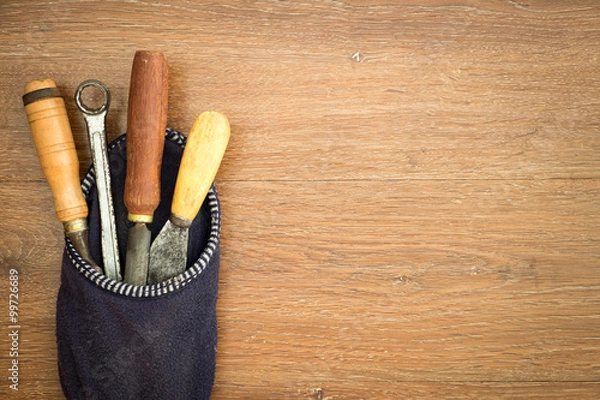 Obraz different old tools on wood