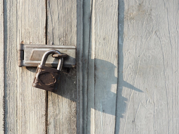 Fototapeta A lock on the door for background