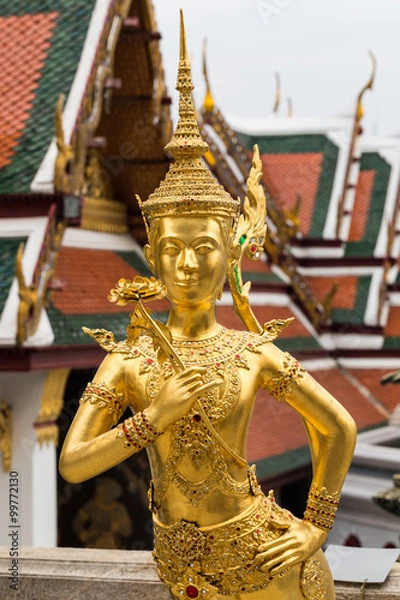 Fototapeta Temple or wat in Bangkok Thailand. Kinnaree sculpture is mythological creature, half of bird and girl at Wat Phra Kaew also called Grand Palace.