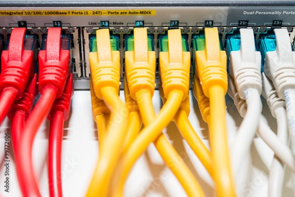 Fototapeta Patching cords connected to switch close up