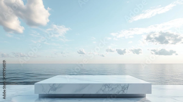 Fototapeta Białe marmurowe podium wyróżnia się na tle rozległego oceanicznego nieba, gdzie odcienie błękitu i bieli splatają się ze sobą w harmonijną całość.