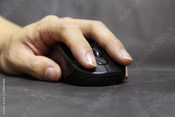 Fototapeta soft focus to hand of the man clicking mouse
