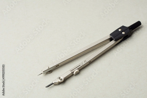 Obraz Compass on a white background. Drawing tools. Close-up. copy space