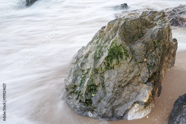 Fototapeta Flowing by the Rocks