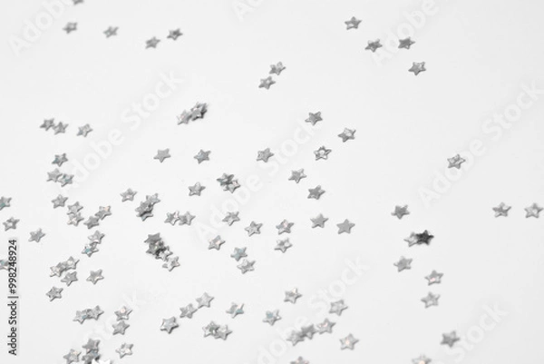 Fototapeta sparkles silver stars on white background with text place- Image