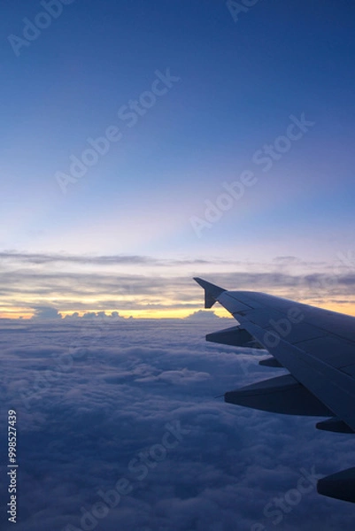 Obraz 飛行機の窓から空と雲