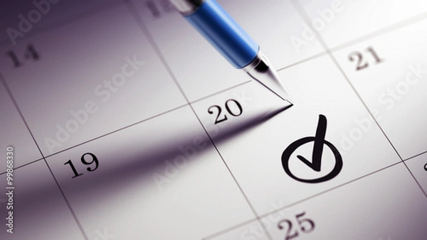 Fototapeta Closeup of a personal agenda setting an important date written w