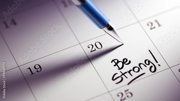 Fototapeta Closeup of a personal agenda setting an important date written w