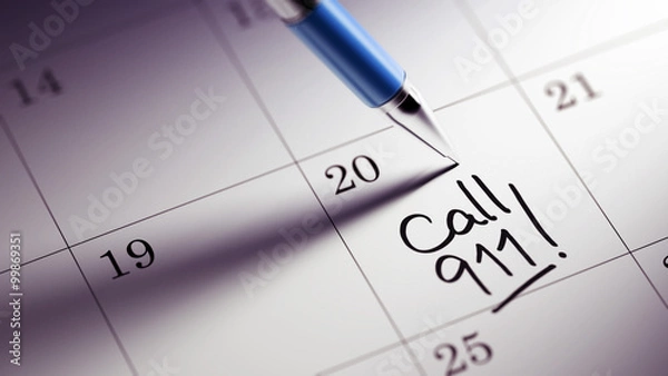 Fototapeta Closeup of a personal agenda setting an important date written w